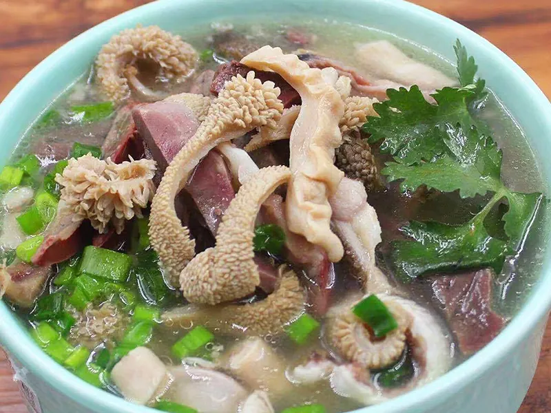 Beef offal soup with fresh herbs at Liuji Szechuan Noodle House BK, a Chinese Restaurant in New York
