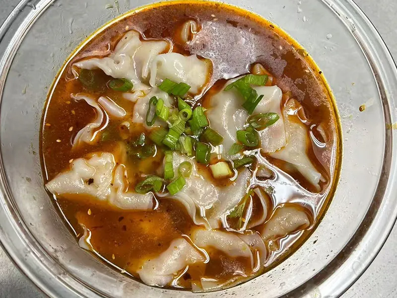Plump wontons in spicy sauce at Liuji Szechuan Noodle House BK, a Chinese Restaurant in New York